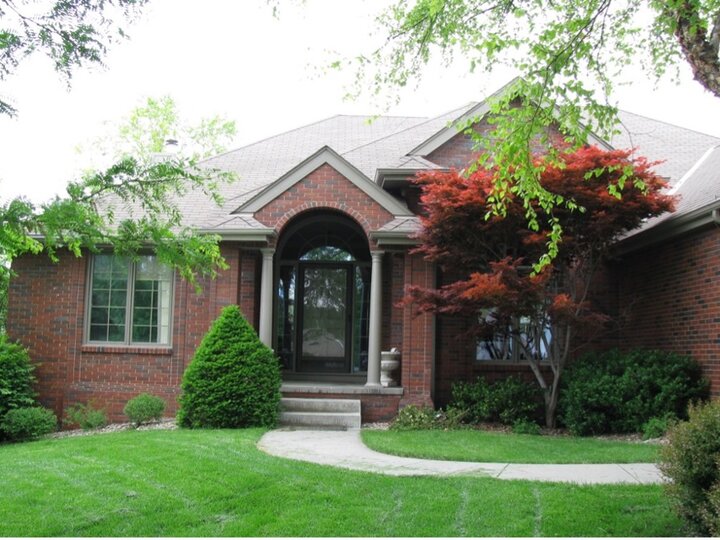 Entrance with home and lawn. 